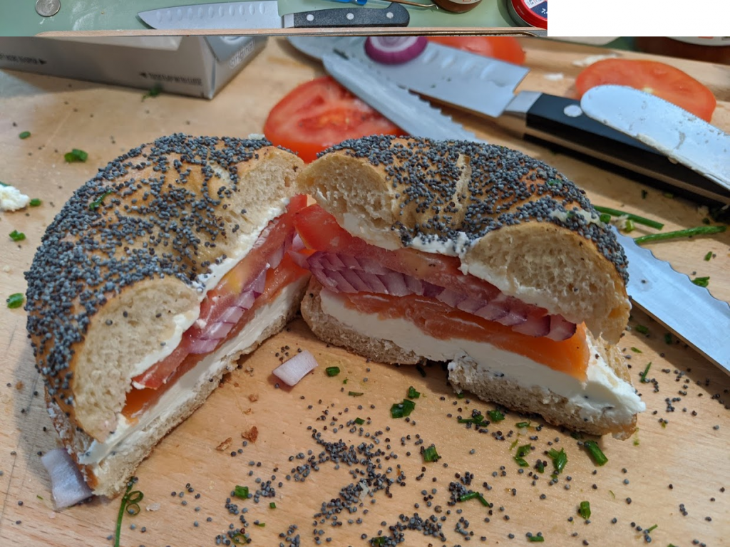 cream cheese, tomato, red onion, and lox bagel